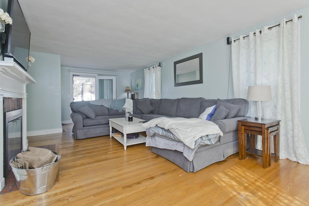 38 Pine Acre Road Springfield, MA 01129 - Photo 17 of 40 a living room with furniture and a fireplace