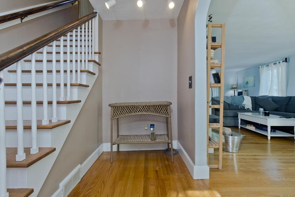 38 Pine Acre Road Springfield, MA 01129 - Photo 20 of 40 a view of a hallway with wooden floor and staircase