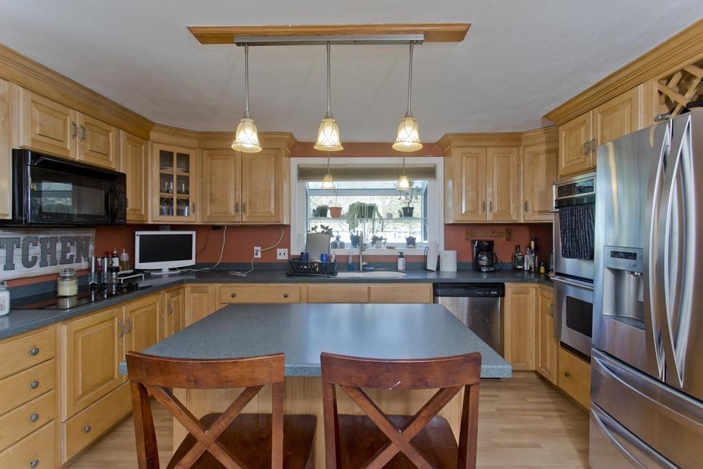 38 Pine Acre Road Springfield, MA 01129 - Photo 2 of 40 a kitchen with stainless steel appliances granite countertop a stove refrigerator sink and microwave