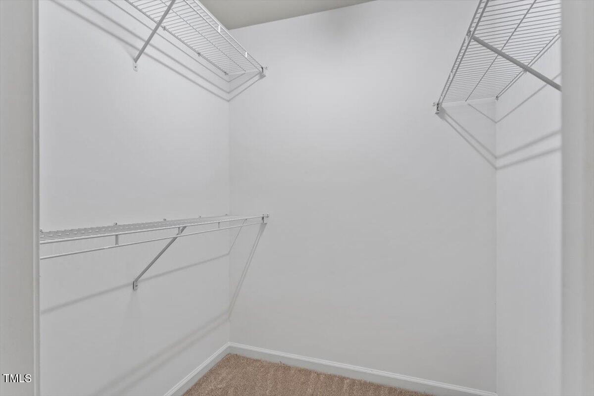 8511 Bright Loop Raleigh, NC 27613 - Photo 26 of 44 Primary Suite Walk In Closet