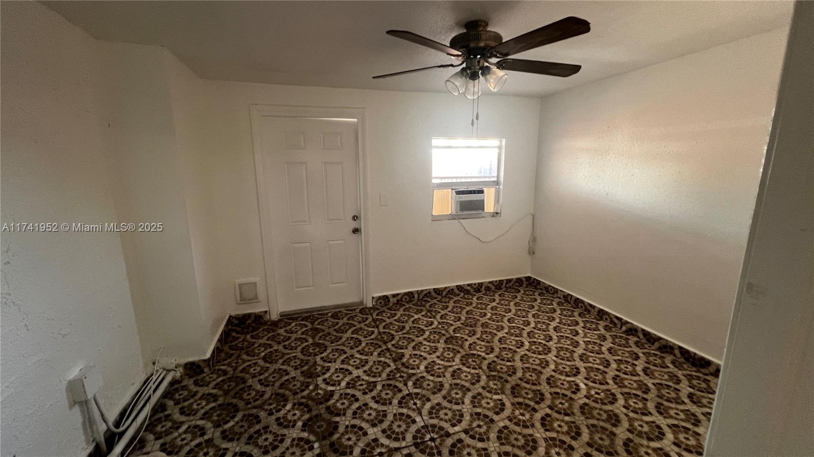 4372 West 11th Lane, Unit 30 Hialeah, FL 33012 - Photo 12 of 23 a bedroom with a bed and a window