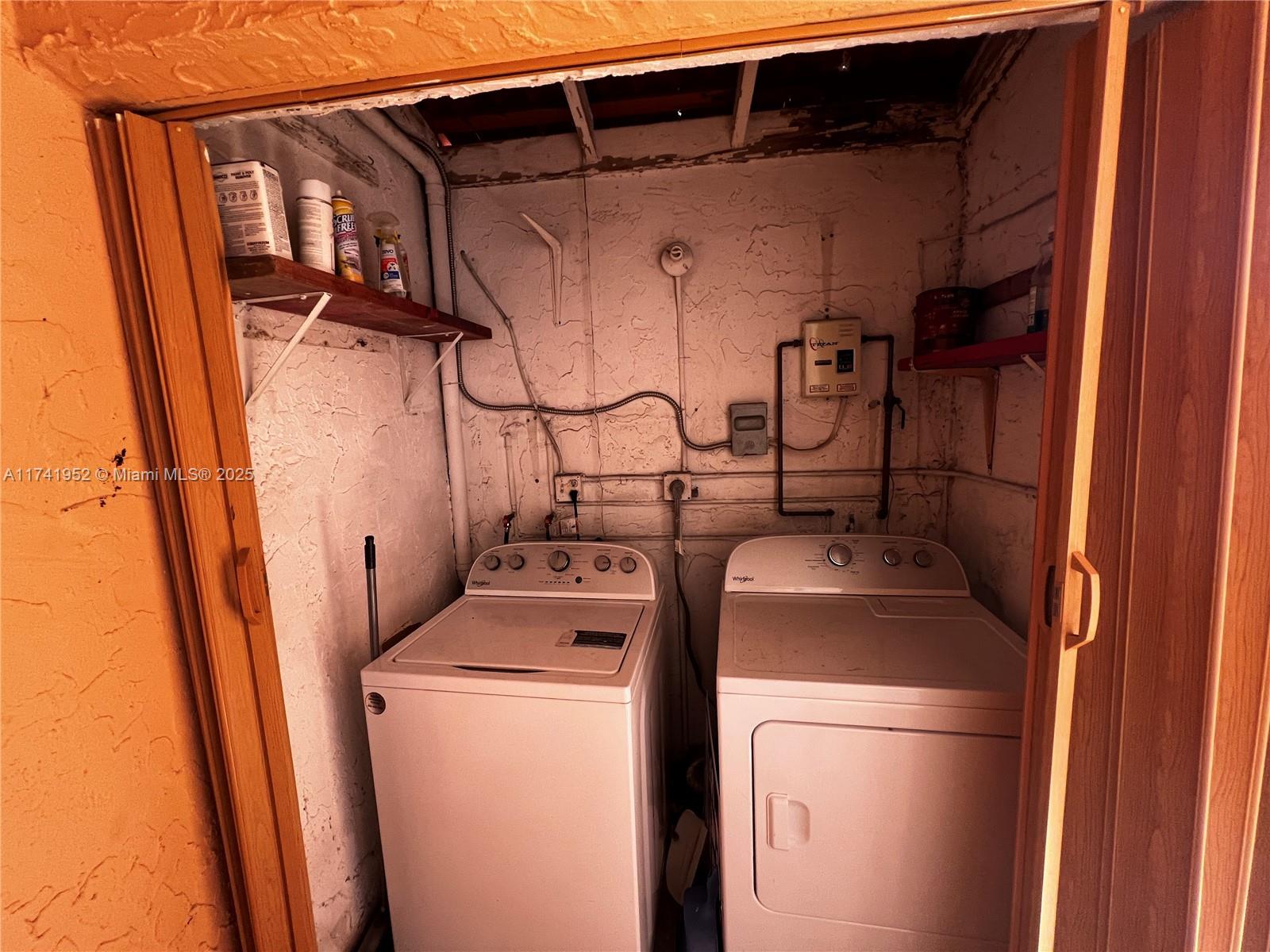 4372 West 11th Lane, Unit 30 Hialeah, FL 33012 - Photo 3 of 23 a utility room with dryer and washer