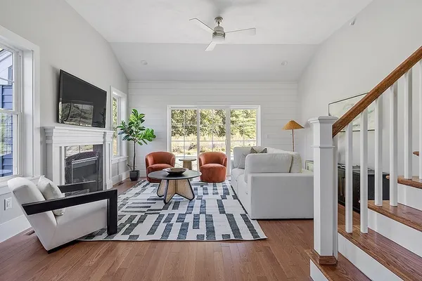 a living room with furniture fireplace and flat screen tv