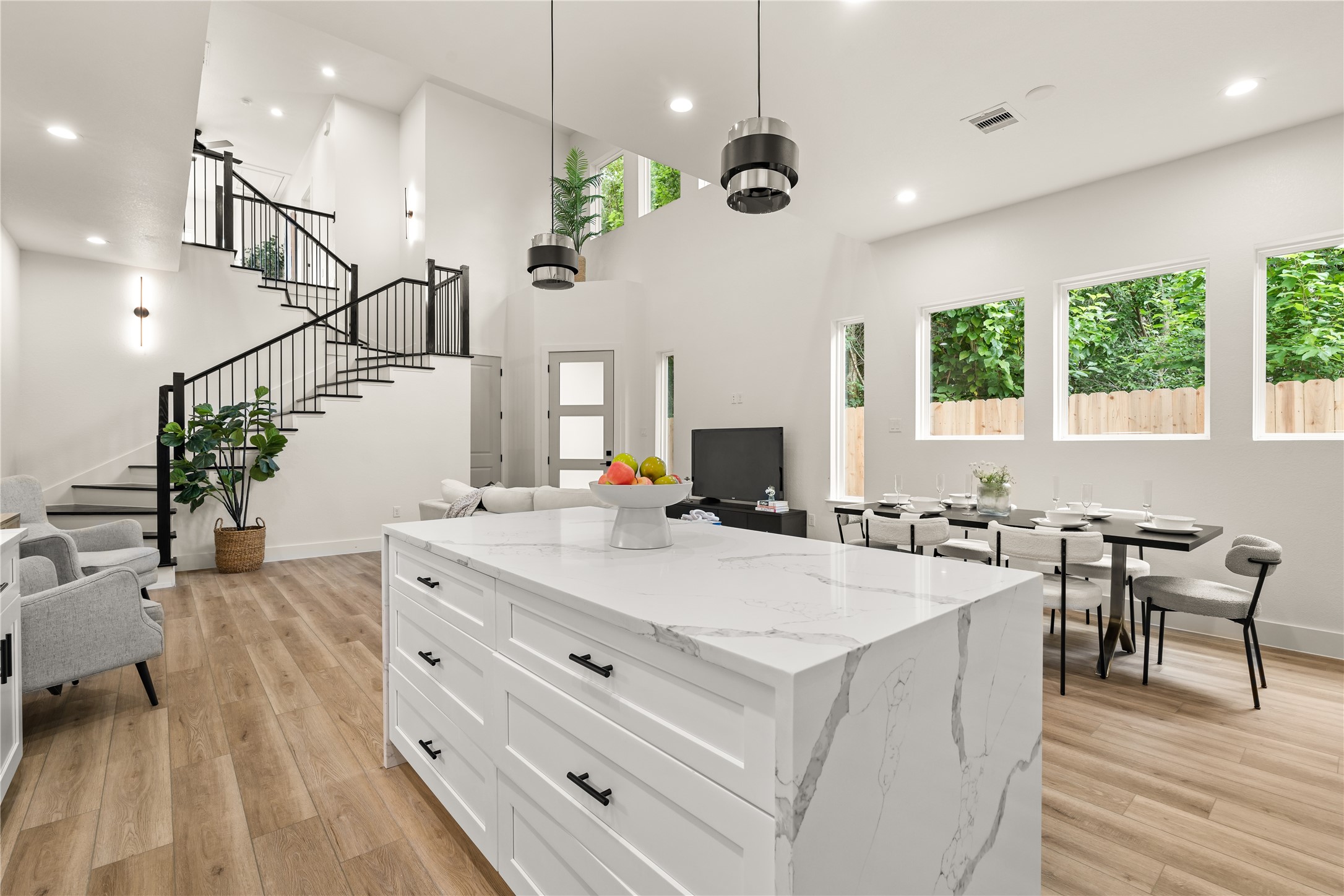 3539 Mainer Street, Unit B Houston, TX 77021 - Photo 8 of 29 The island anchors it all — kitchen, dining, and living connected in one open space