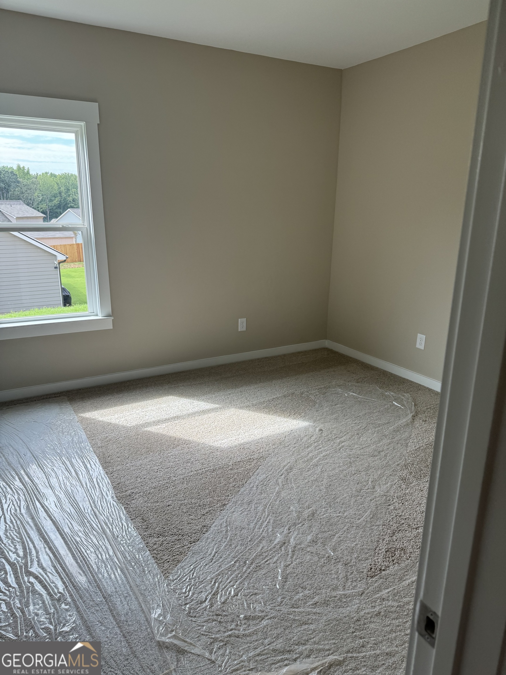 258 Westminster Court Winder, GA 30680 - Photo 11 of 16 an empty room with a window