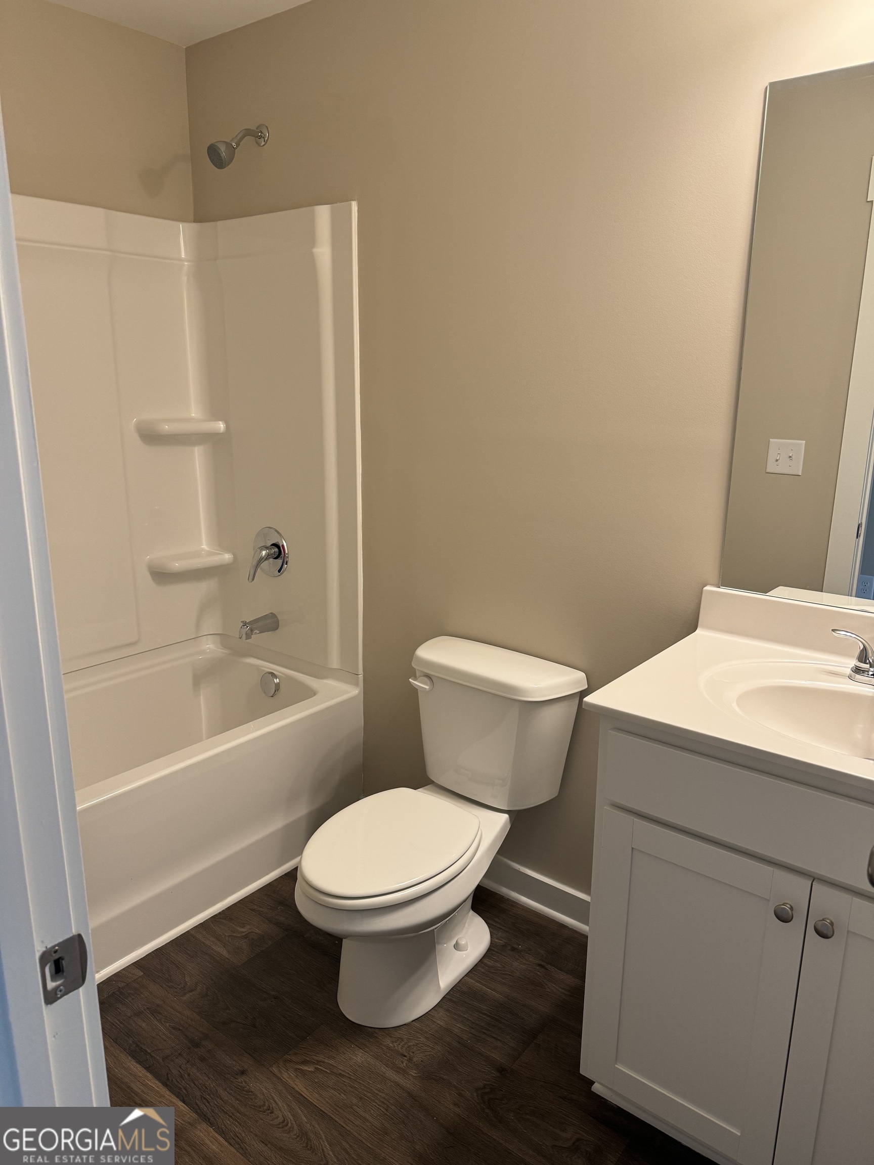 258 Westminster Court Winder, GA 30680 - Photo 13 of 16 a white toilet sitting next to a bath tub