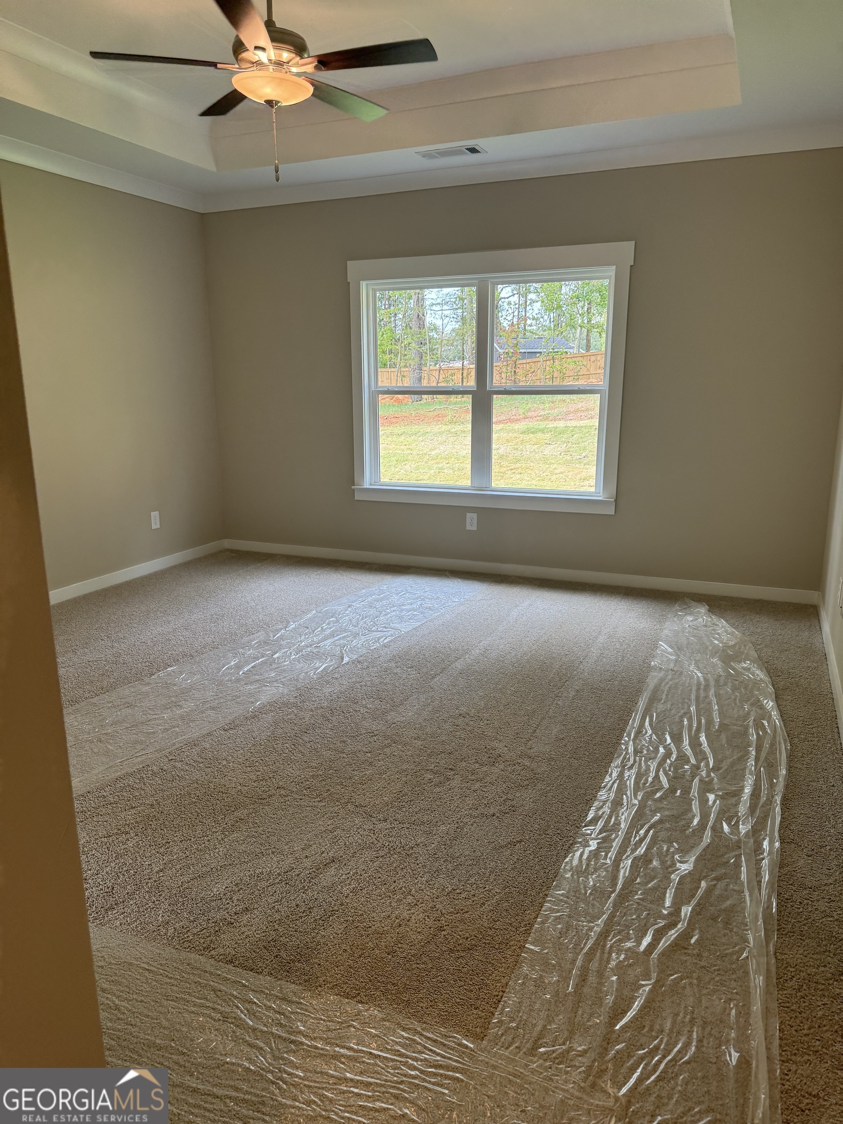 258 Westminster Court Winder, GA 30680 - Photo 5 of 16 a view of an empty room with a window