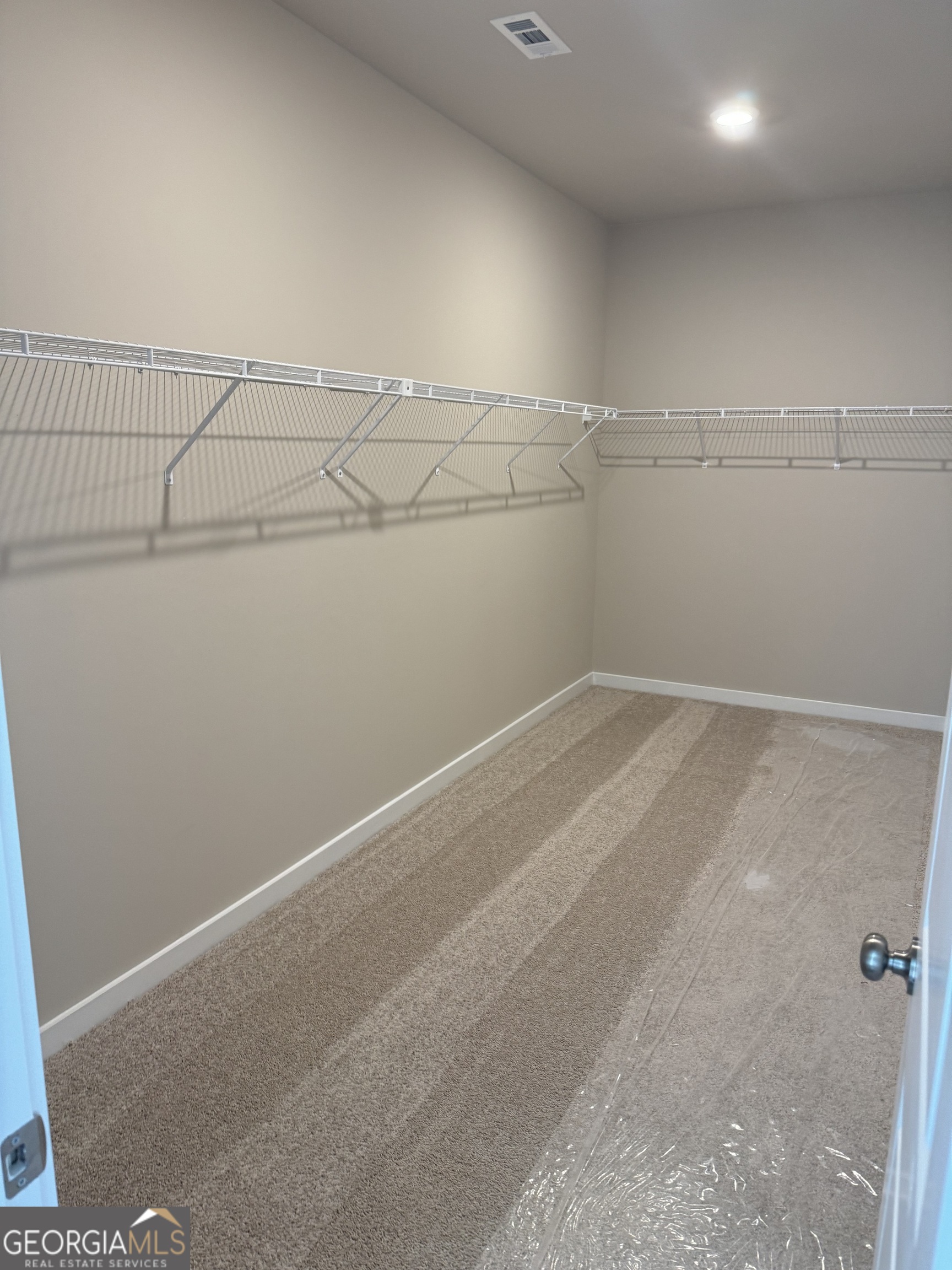 258 Westminster Court Winder, GA 30680 - Photo 7 of 16 a view of a room with racks on the wall