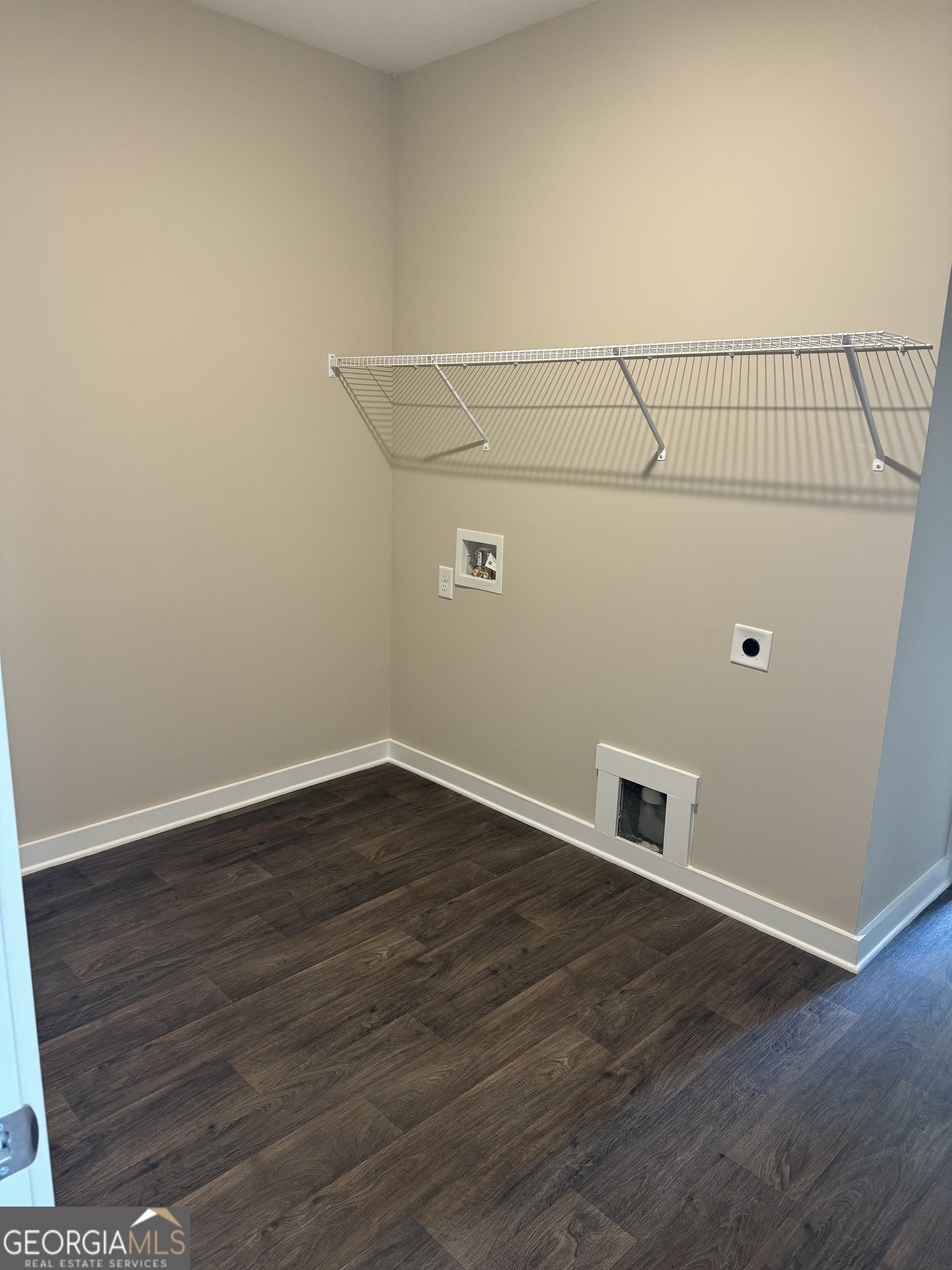 258 Westminster Court Winder, GA 30680 - Photo 8 of 16 a view of a hallway with wooden floor