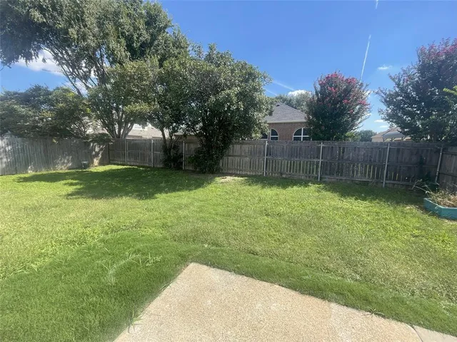 a view of a backyard with a small cabin