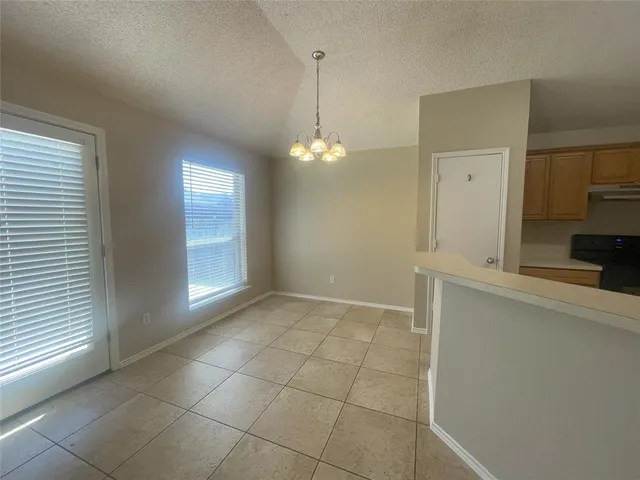 a view of a kitchen with a sink and a window