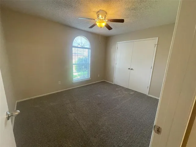 a view of empty room with windows