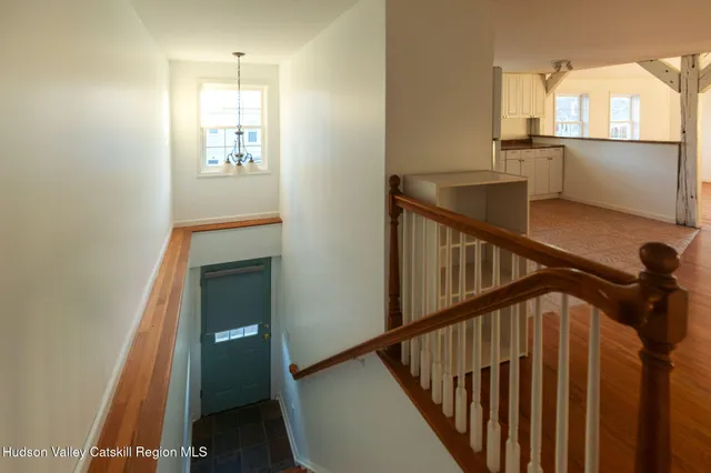 a view of a hallway with windows