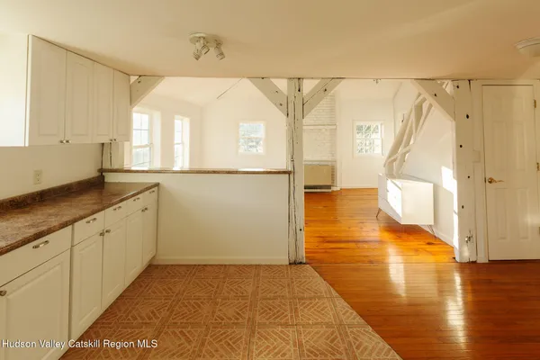 a view of a bathroom with a sink and a shower