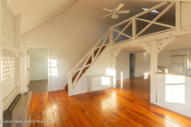 a view of an entryway with wooden floor