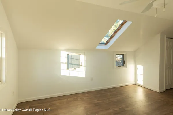 a view of an empty room and a window