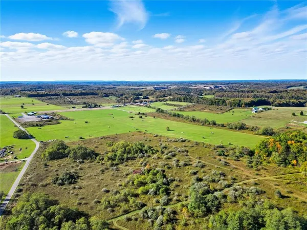a view of a field with an ocean