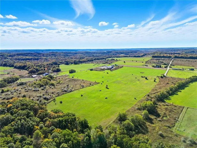 a view of a swimming pool with a yard