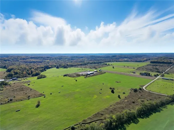 a view of a field with sitting area