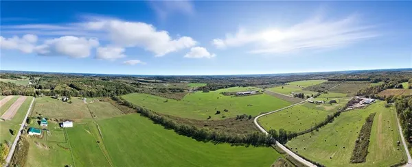 an aerial view of a residential houses with outdoor space