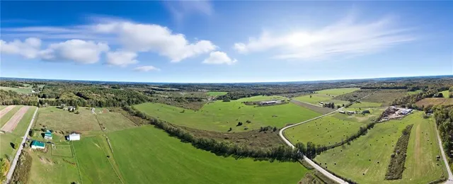 an aerial view of a residential houses with outdoor space