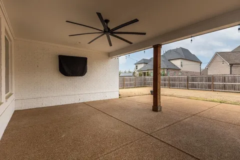 a empty room with sliding glass door