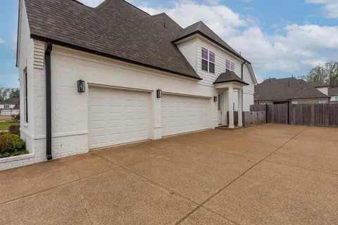 a front view of a house with a garage