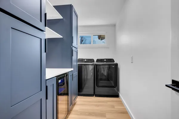 a view of a hallway with washer and dryer