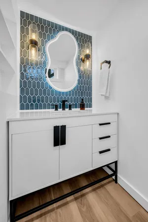 a bathroom with a sink and a mirror
