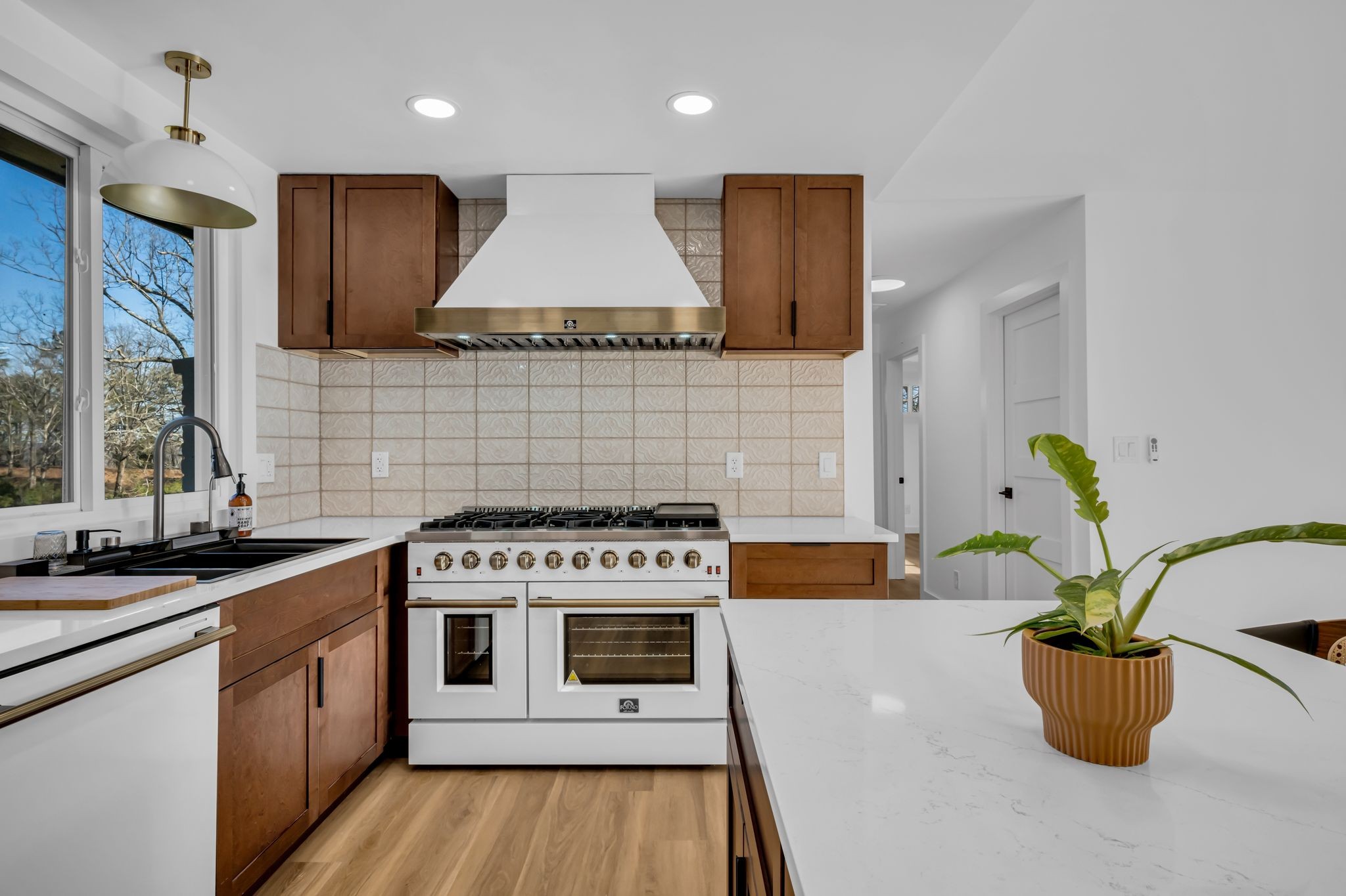 1033 Pine Valley Road Kingston Springs, TN 37082 - Photo 7 of 42 a kitchen with a stove a sink and a cabinets