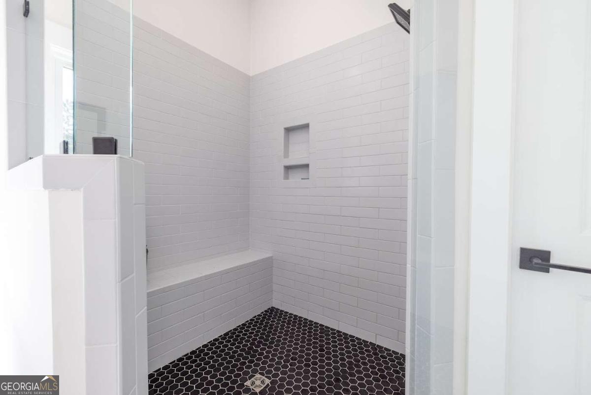 988 Boozer Road Heflin, AL 36264 - Photo 16 of 52 a bathroom with a bathtub and a shower