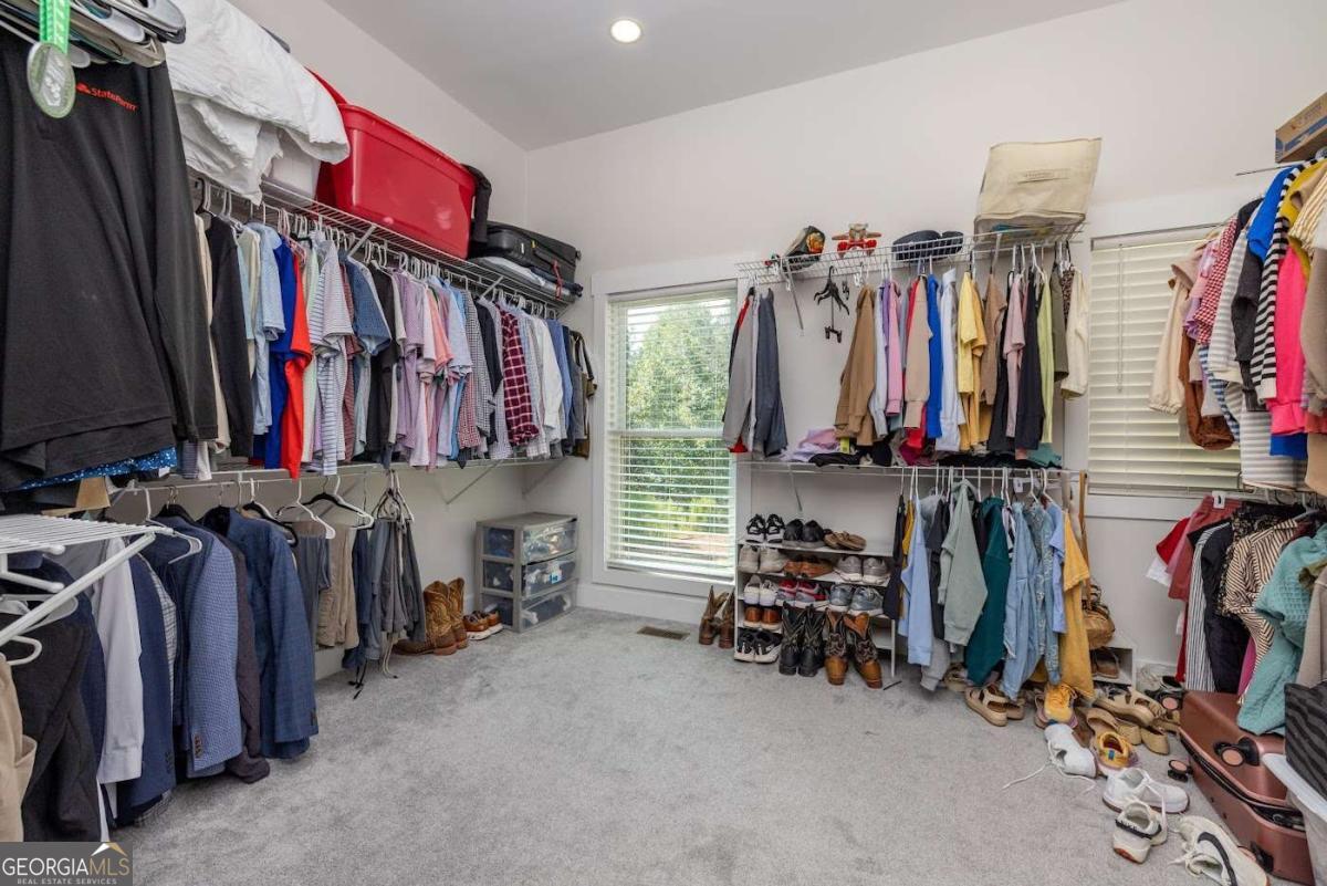 988 Boozer Road Heflin, AL 36264 - Photo 18 of 52 a view of walk in closet with clothes and shoes