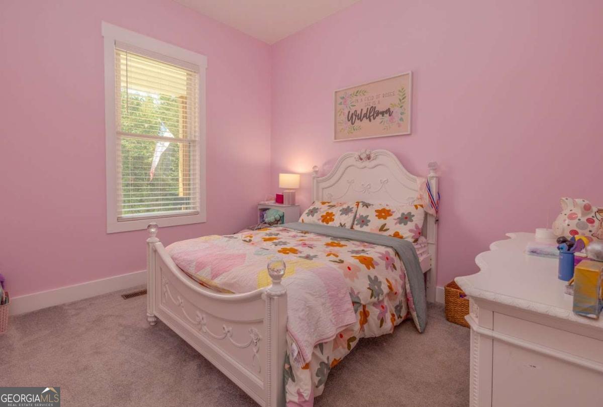 988 Boozer Road Heflin, AL 36264 - Photo 20 of 52 a bedroom with a bed and a window