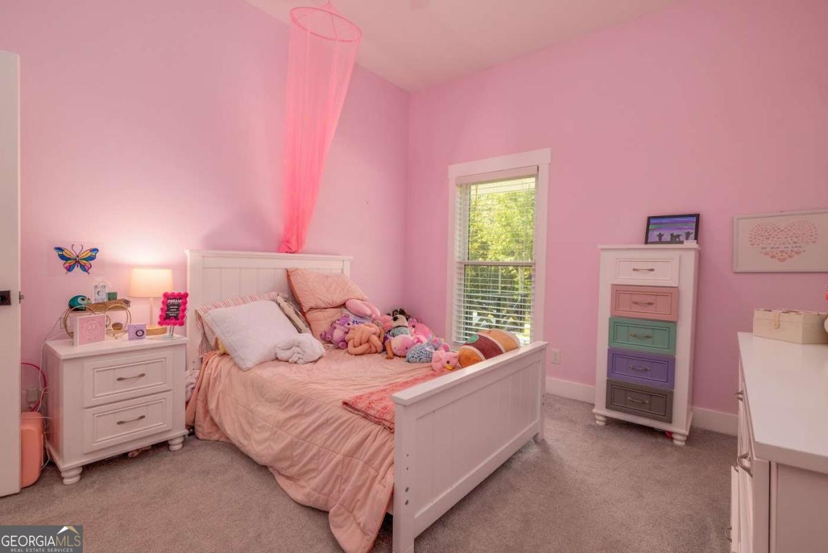 988 Boozer Road Heflin, AL 36264 - Photo 24 of 52 a bedroom with a bed and a dresser