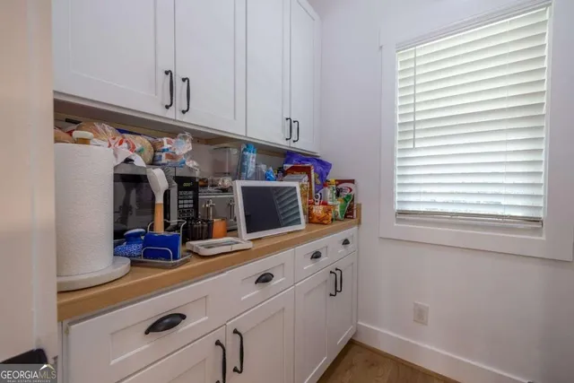 a utility room with sink dryer and washer