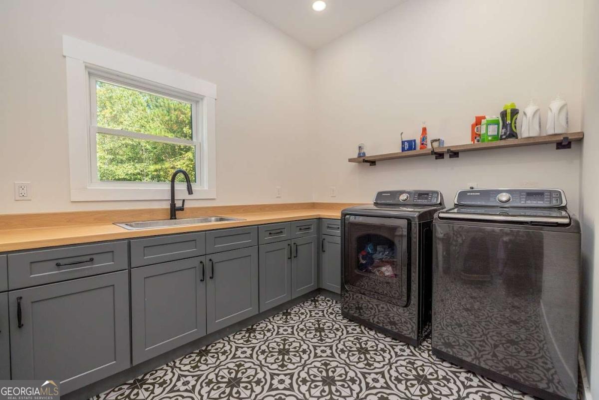 988 Boozer Road Heflin, AL 36264 - Photo 26 of 52 a utility room with sink dryer and washer