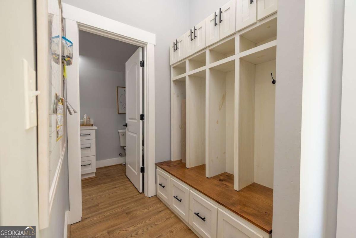 988 Boozer Road Heflin, AL 36264 - Photo 27 of 52 a bathroom with a granite countertop sink and a mirror