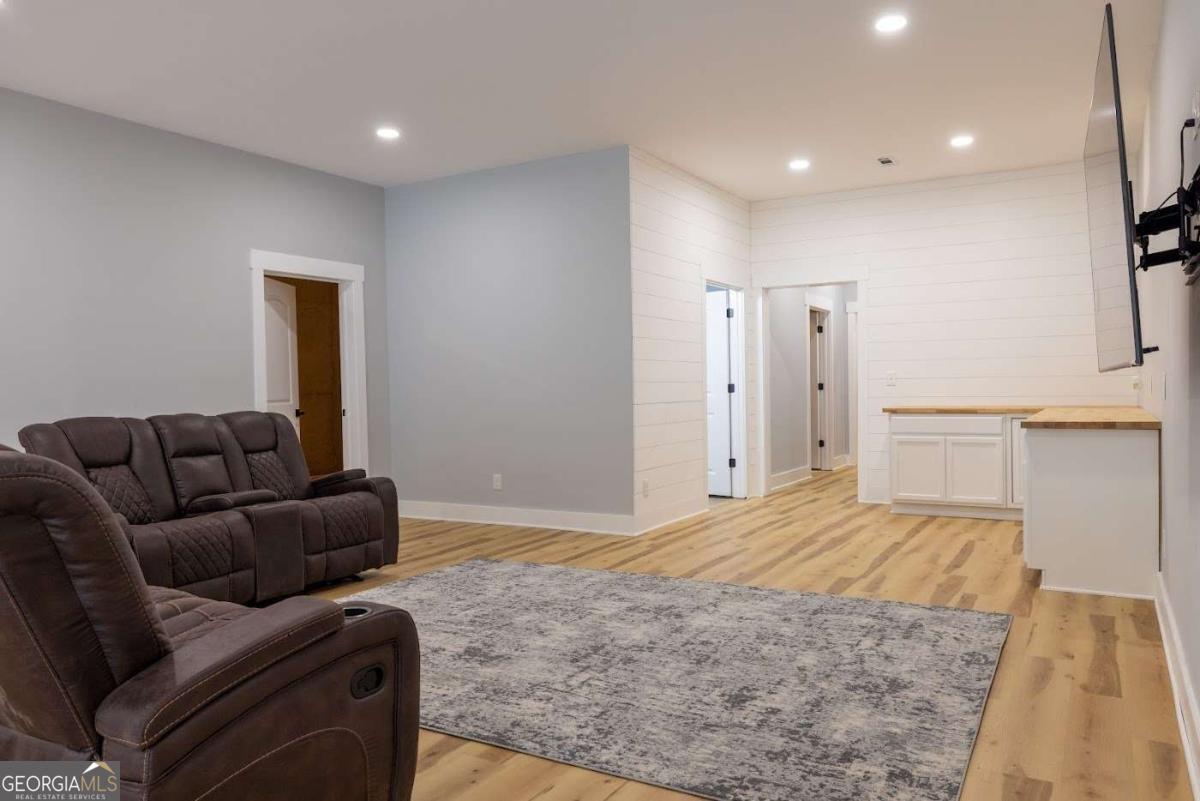 988 Boozer Road Heflin, AL 36264 - Photo 33 of 52 a living room with a couch and a rug