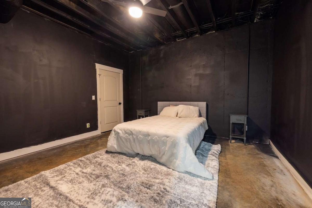 988 Boozer Road Heflin, AL 36264 - Photo 36 of 52 a bedroom with a bed and a wooden floor