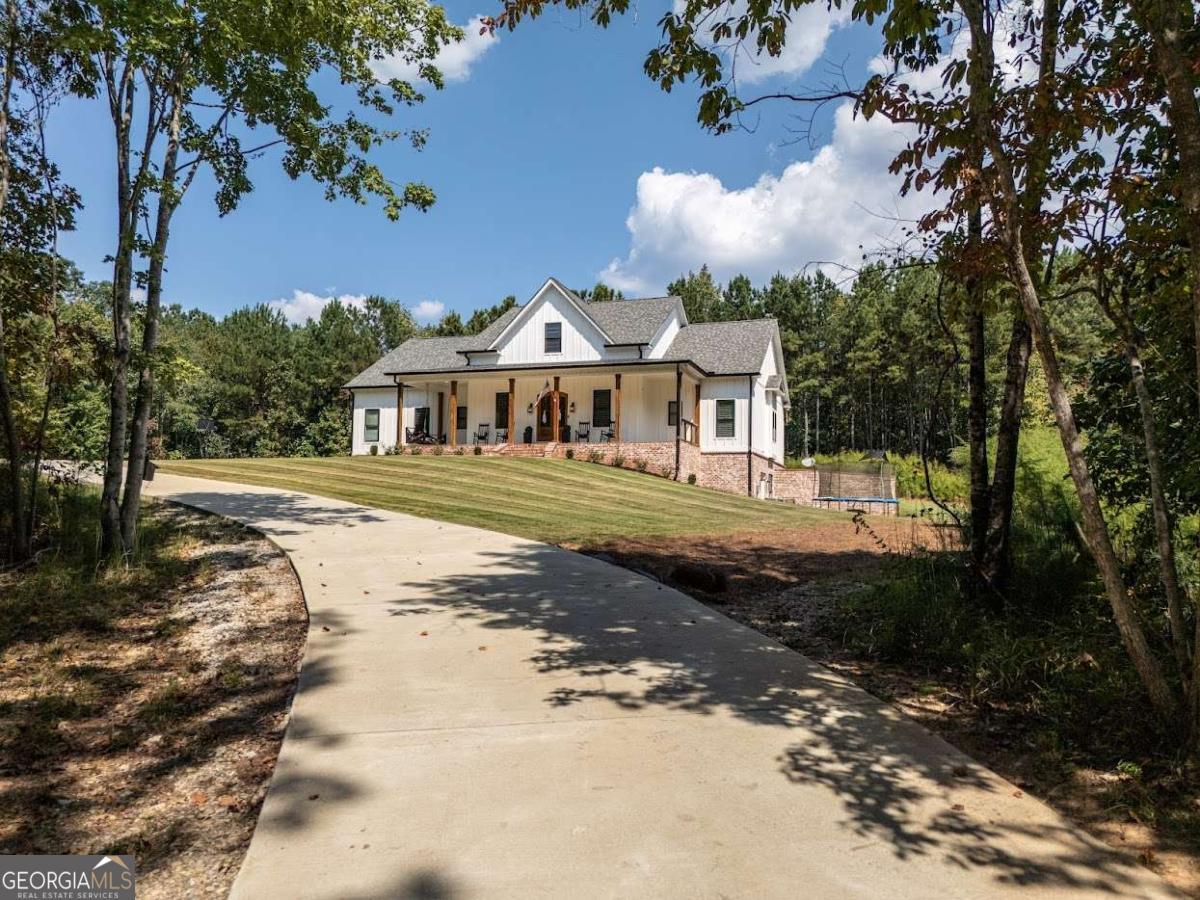 988 Boozer Road Heflin, AL 36264 - Photo 37 of 52 a front view of a house with a yard
