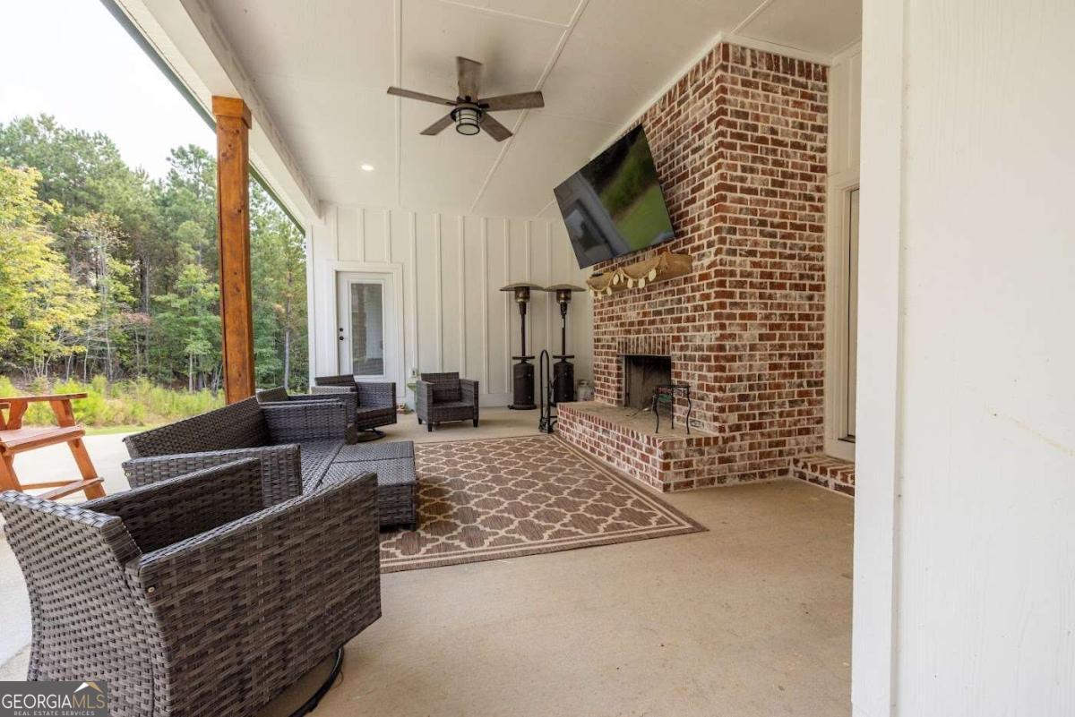988 Boozer Road Heflin, AL 36264 - Photo 41 of 52 a living room with furniture and a fireplace