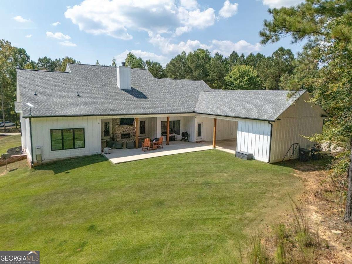 988 Boozer Road Heflin, AL 36264 - Photo 42 of 52 a view of a house with a backyard