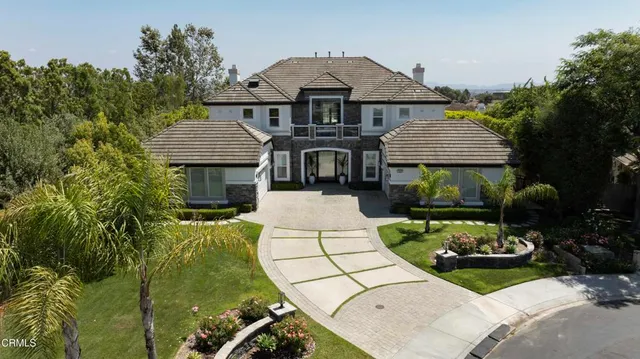 a swimming pool with outdoor seating and yard