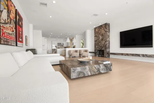 a kitchen with stainless steel appliances white cabinets and a sink