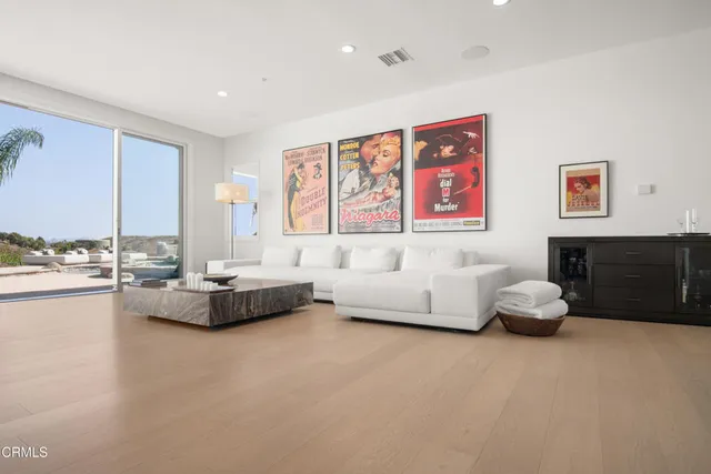a kitchen with stainless steel appliances kitchen island granite countertop a stove and a sink
