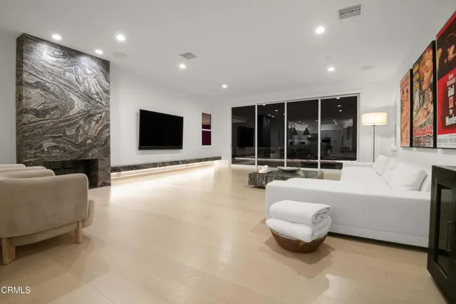 a bedroom with a large bed and a couch