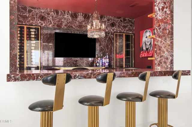 a white bath tub sitting next to a white sink