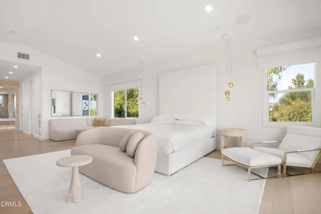 an aerial view of a house with swimming pool and porch