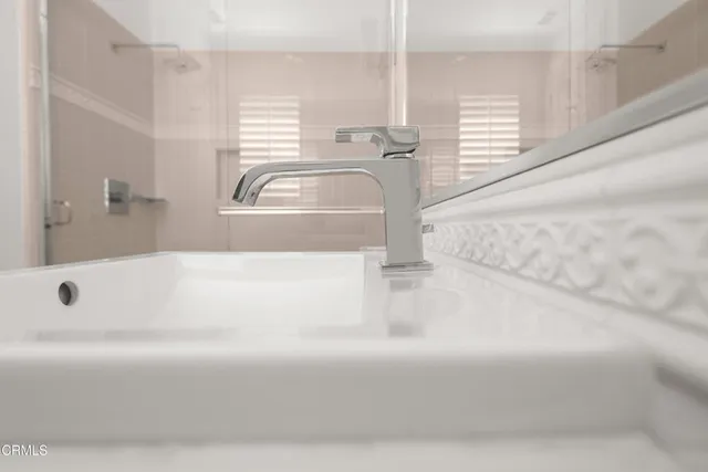 an aerial view of a house with a garden and lake view