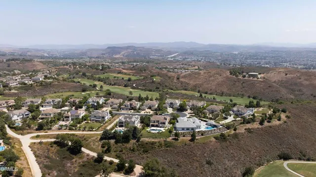 a terrace with outdoor seating and city view